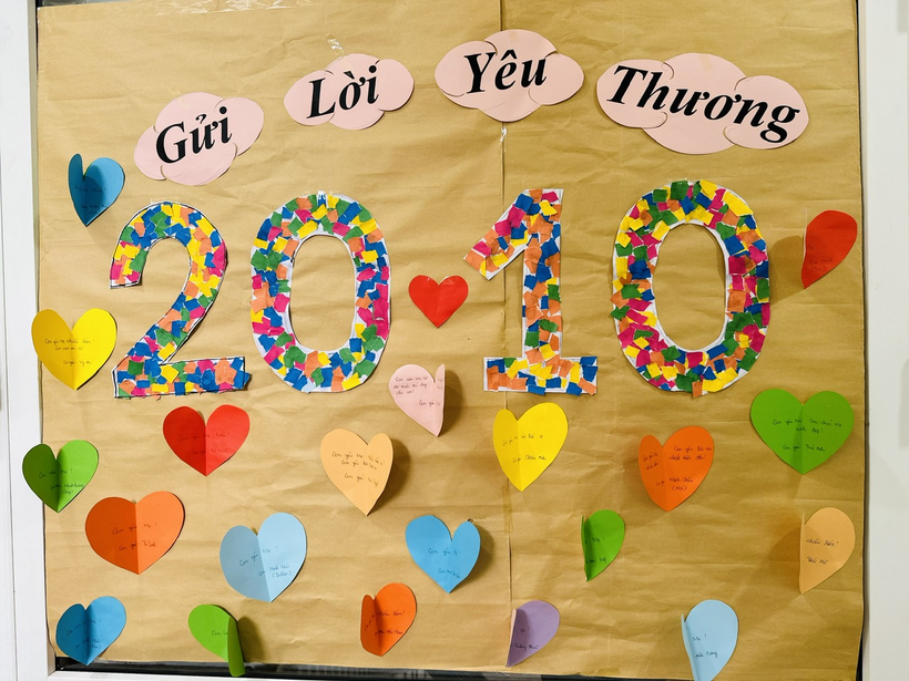 A board with paper hearts and numbersDescription automatically generated